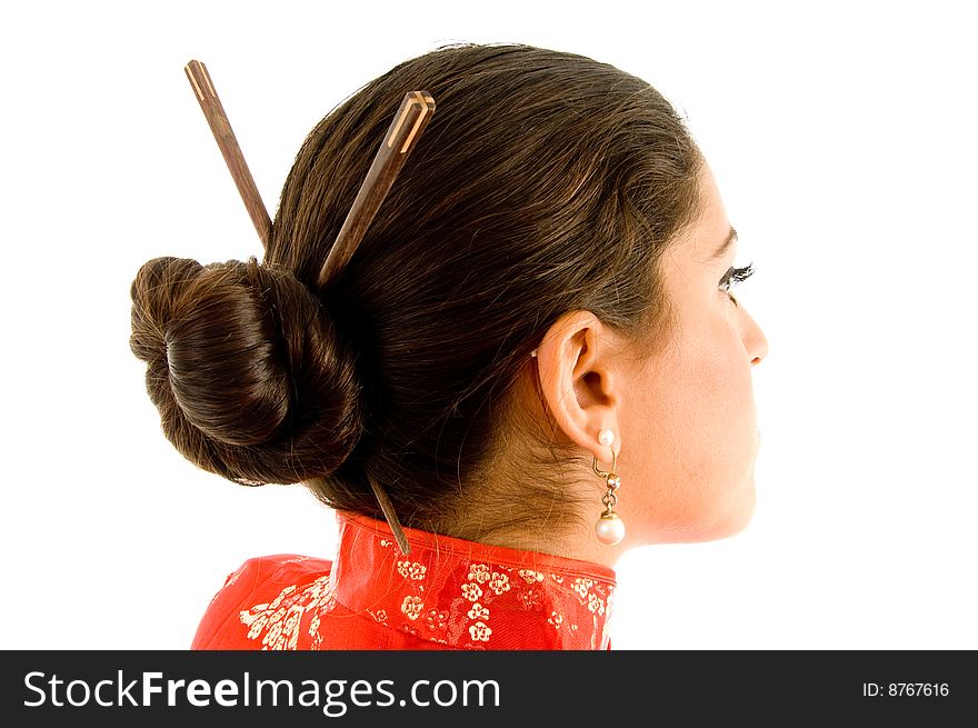 Beautiful woman with hair sticks on an isolated background