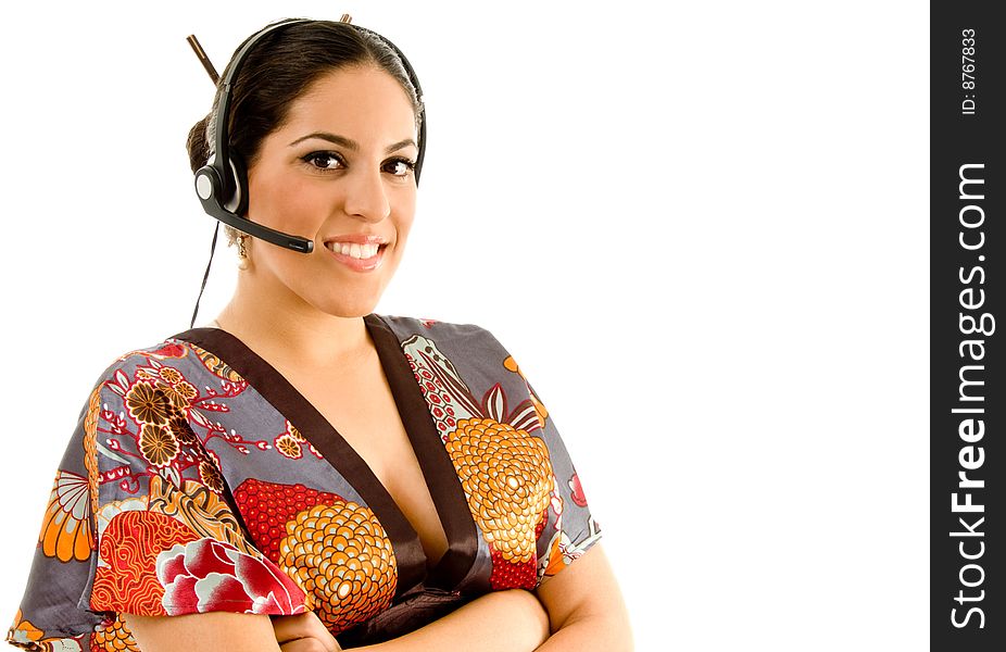 Young female wearing kimono with headset against white background