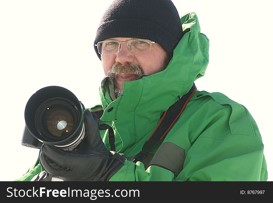 Photographer holding camera with big lens