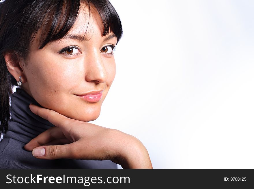 Portrait of beautiful woman with hand touching her head