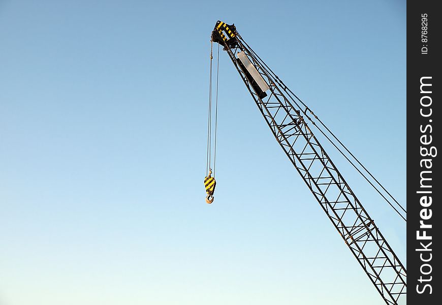 Crane on a clear, blue sky background