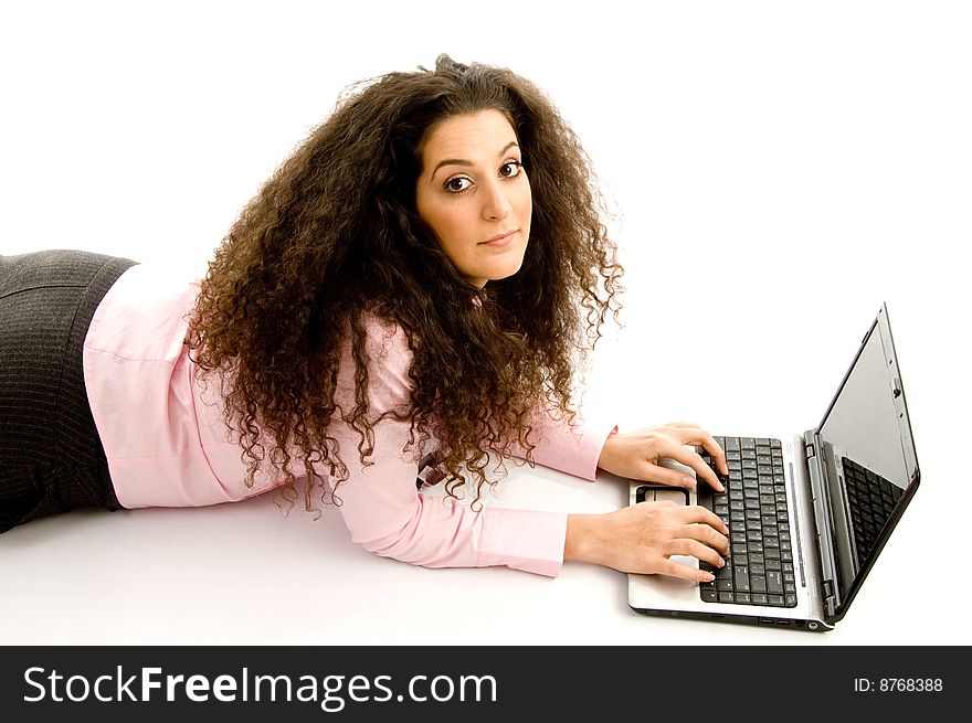 Attractive young executive busy with laptop on an isolated white background