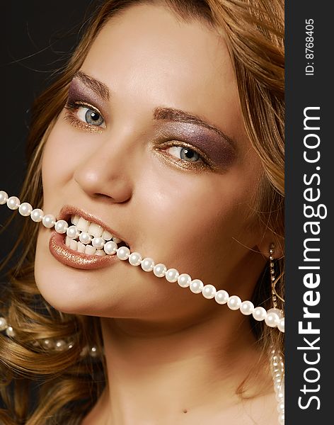 Fashion portrait of a girl with pearls. Fashion portrait of a girl with pearls