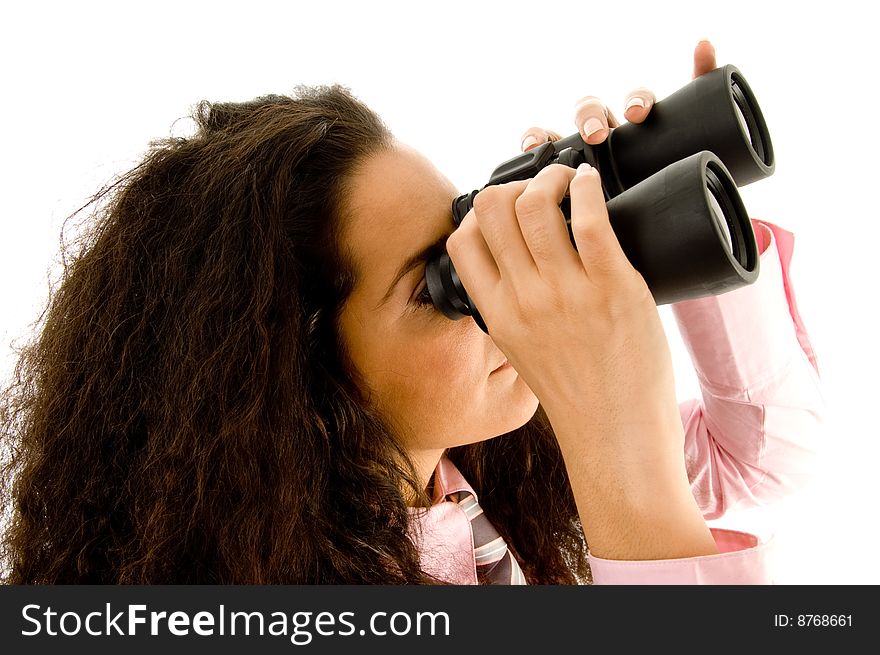 Smart young businesswoman looking through binoculars on an isolated background