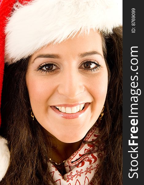 Hispanic female wearing christmas hat and smiling in front of camera