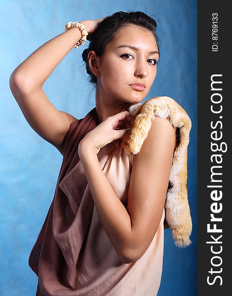 Elegant woman touching head with handsÑŽ Fashion photo