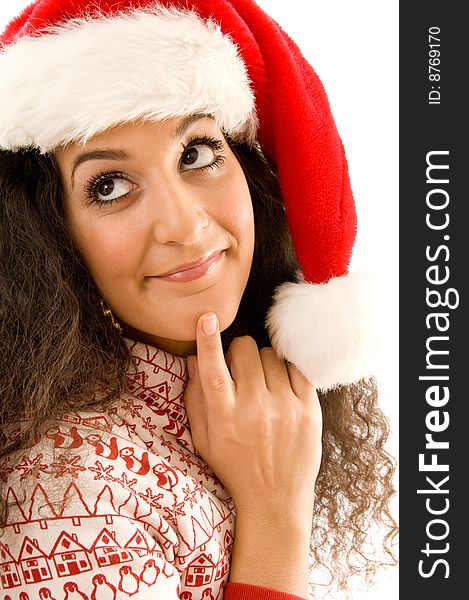 Fashionable woman wearing christmas hat and thinking something on an isolated background