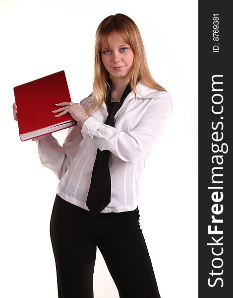 Woman in a necktie with a red book serious looking at you