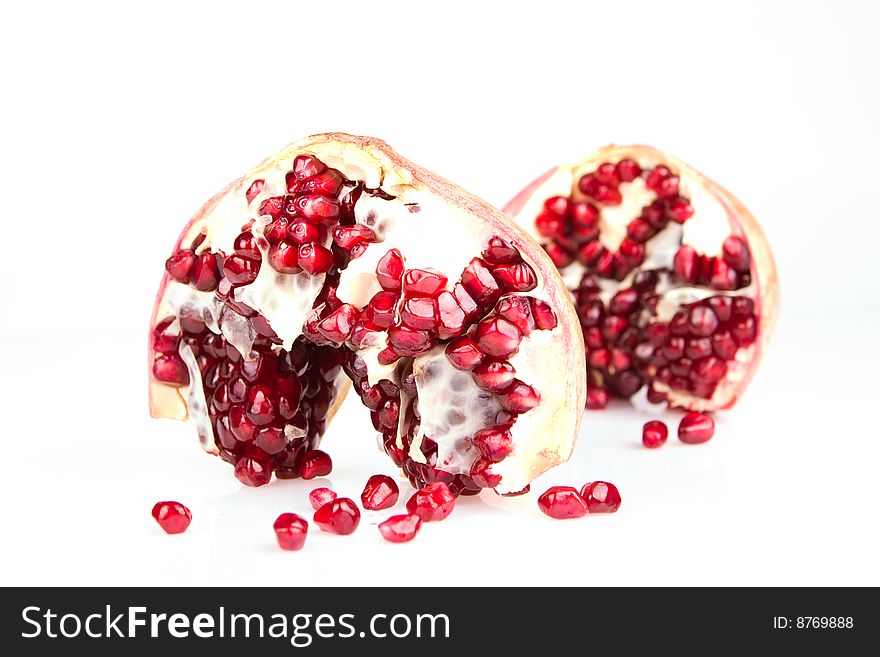 Fresh appetizing pomegranate on a white background. Fresh appetizing pomegranate on a white background