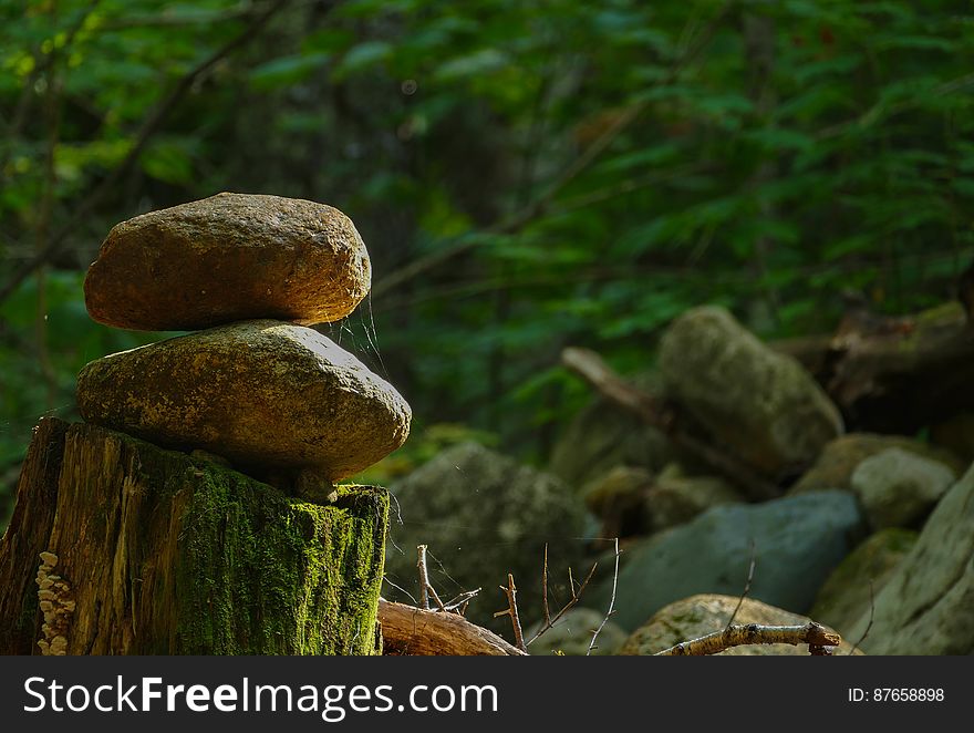 Stacked stones, lonely lighting.