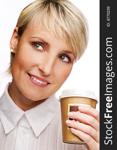 Young blond woman drinking cup of coffee close up