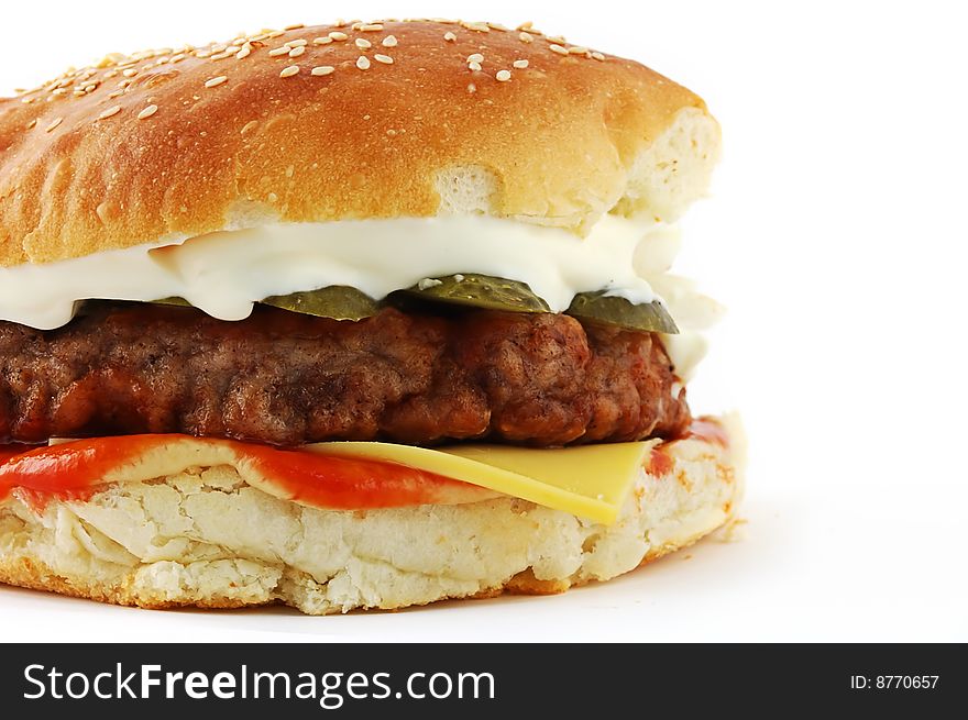 Hamburger with tomatoes and mayonnaise on white a background