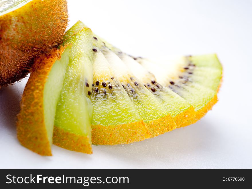 Sliced ripe fresh kiwi isolated on white. Sliced ripe fresh kiwi isolated on white