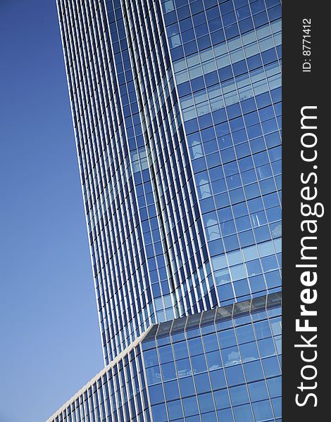 Modern office center on a background of the blue sky. Modern office center on a background of the blue sky