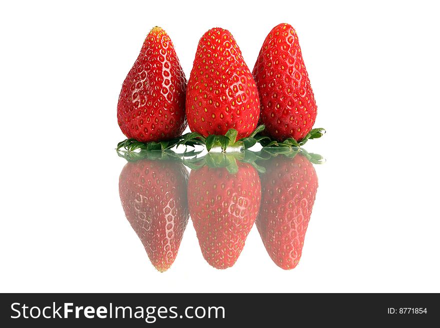 Close up of Korea strawberry standing over white background.