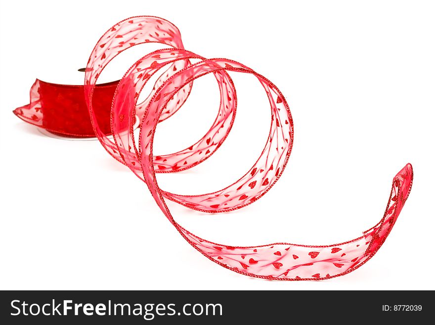 Spool of red heart ribbon on isolated white