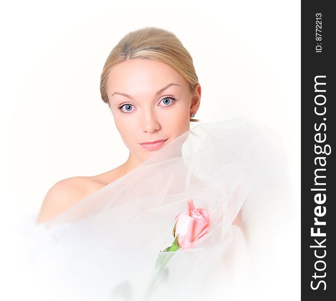 Gentle portrait of the charming girl with a pink rose. Gentle portrait of the charming girl with a pink rose