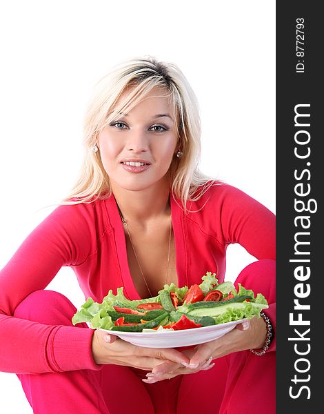 Girl in sport outfit with salad isolated on white. Girl in sport outfit with salad isolated on white