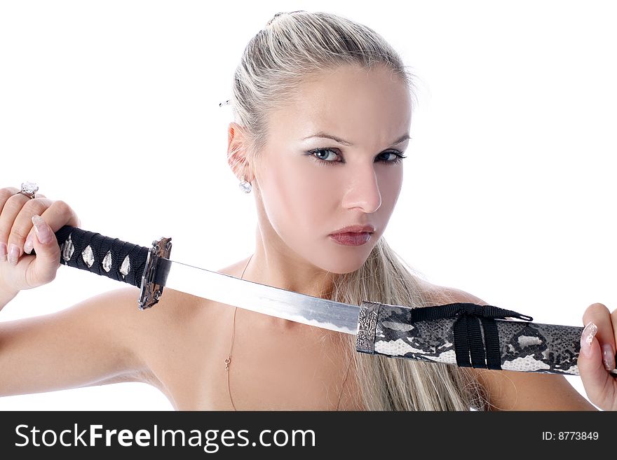 Lovely woman holding in her hands a katana isolated on white. Lovely woman holding in her hands a katana isolated on white