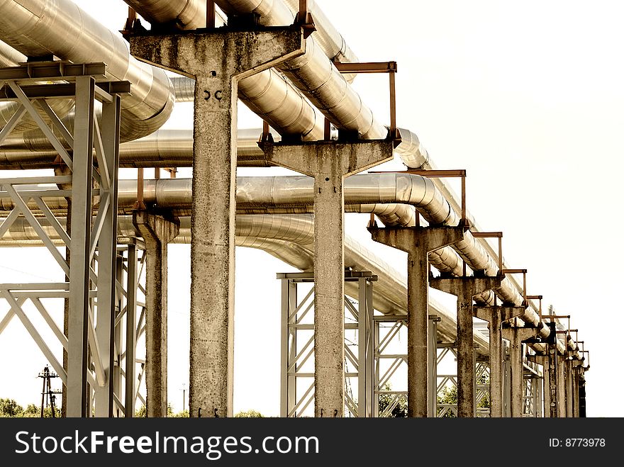 Steel pipe-line is photographed on sky background