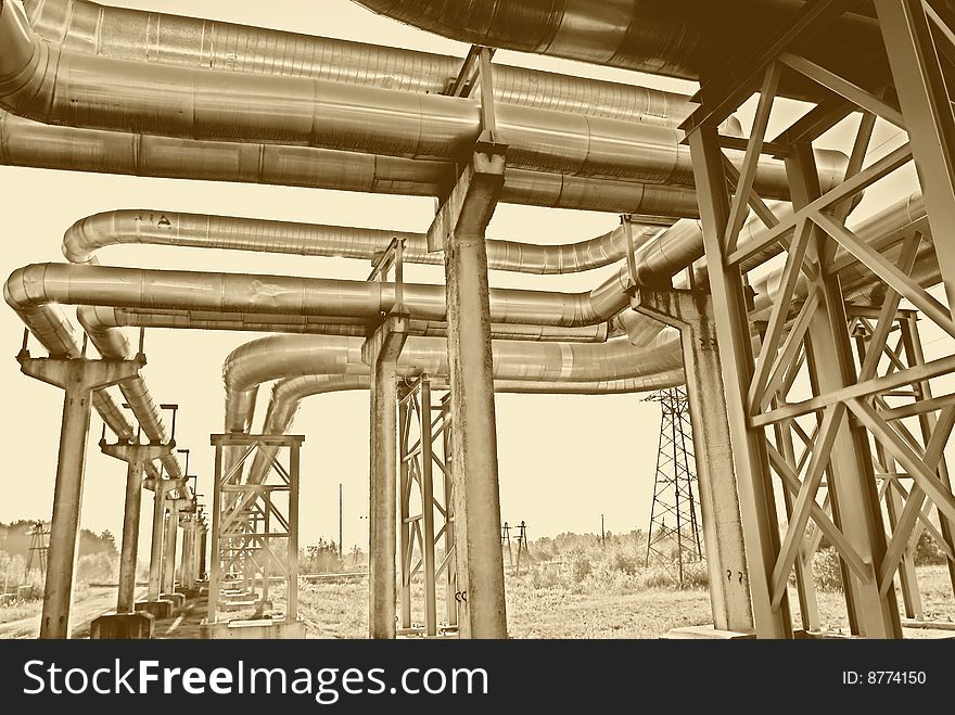 Metallic pipeline over blue sky. Metallic pipeline over blue sky