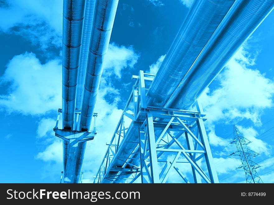 Metallic pipeline over blue sky. Metallic pipeline over blue sky