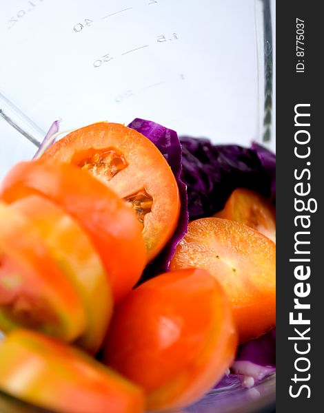 Vegetables being prepared in a blender to make a vegetables juice. Vegetables being prepared in a blender to make a vegetables juice