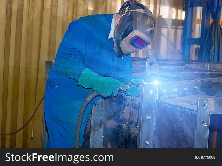 Welder at work. Industrial photo.