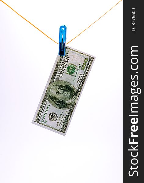 Dollar banknote hangs on a cord