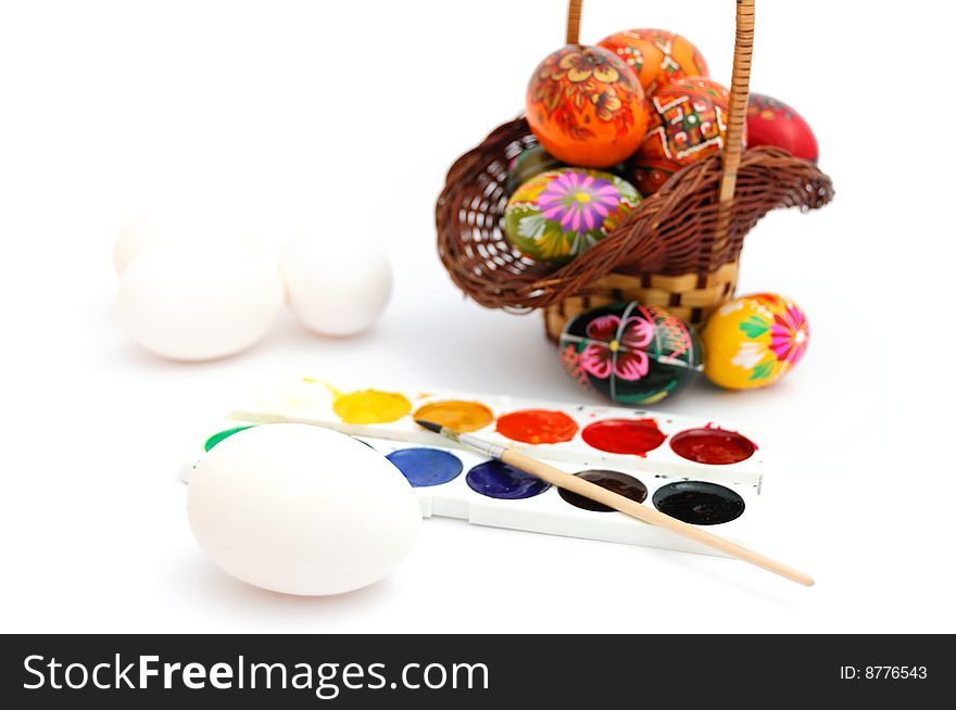 Painted and unpainted easter eggs, water-colour paints. Painted and unpainted easter eggs, water-colour paints