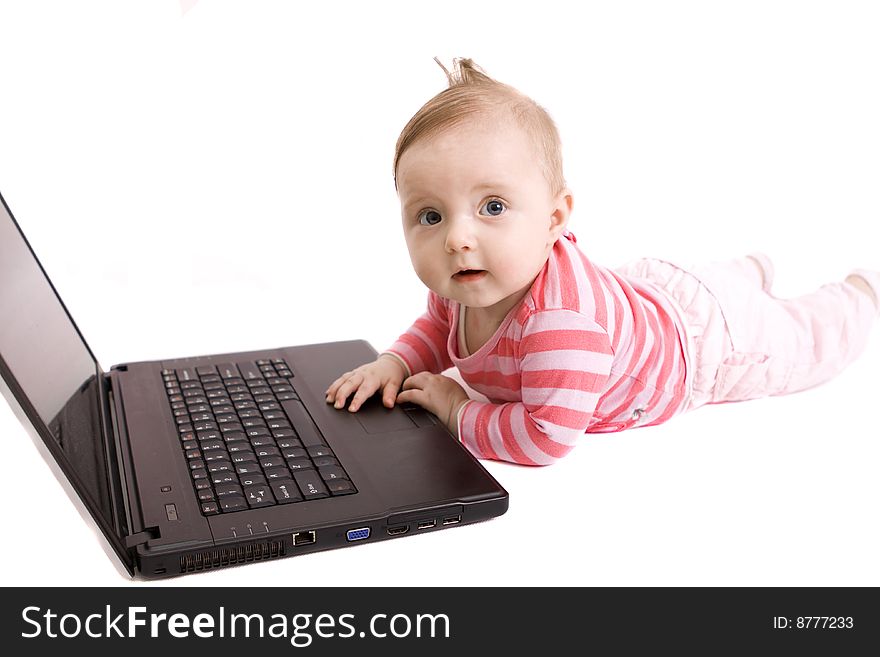 Little baby with laptop on white