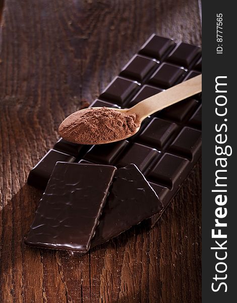 Rich dark chocolate bar with cocoa powder