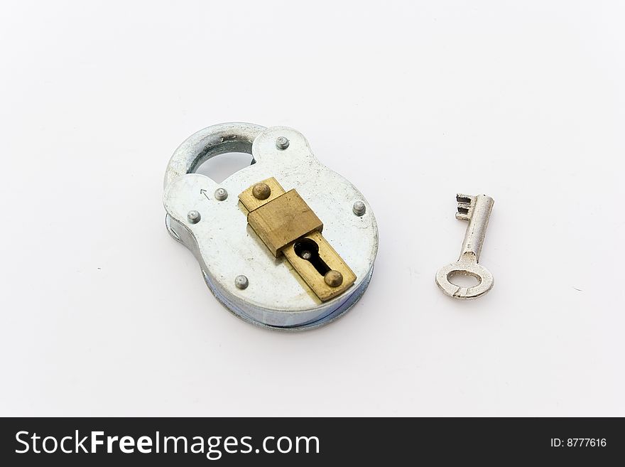 A padlock and key on a light background