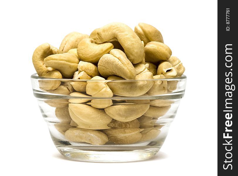 Pistachios in a dish on white background