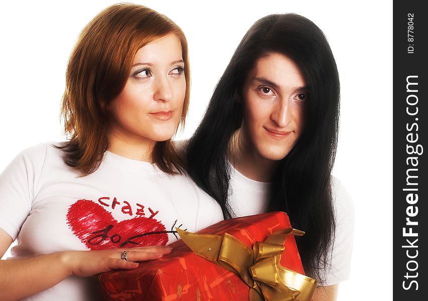 Young happy couple with big red present box.