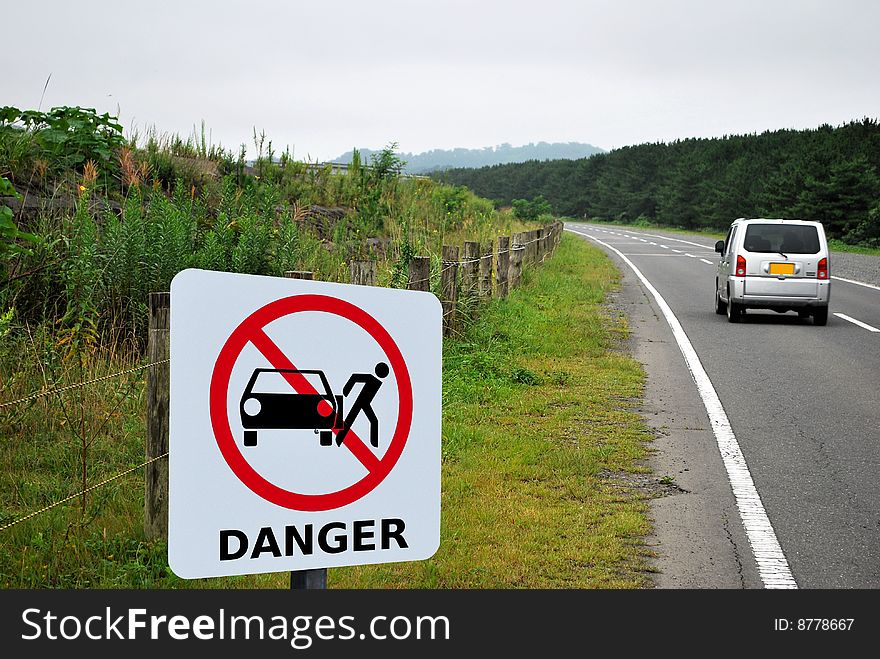 Danger signage at side of road