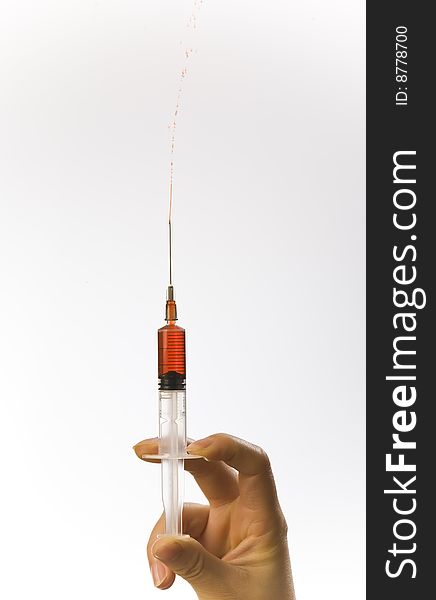 Blood extraction - filled syringe isolated on white background. Blood extraction - filled syringe isolated on white background.