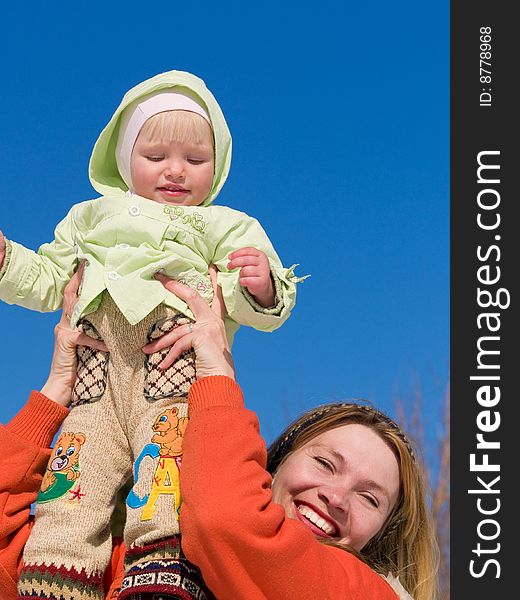 Mother keeps daughter at springtime