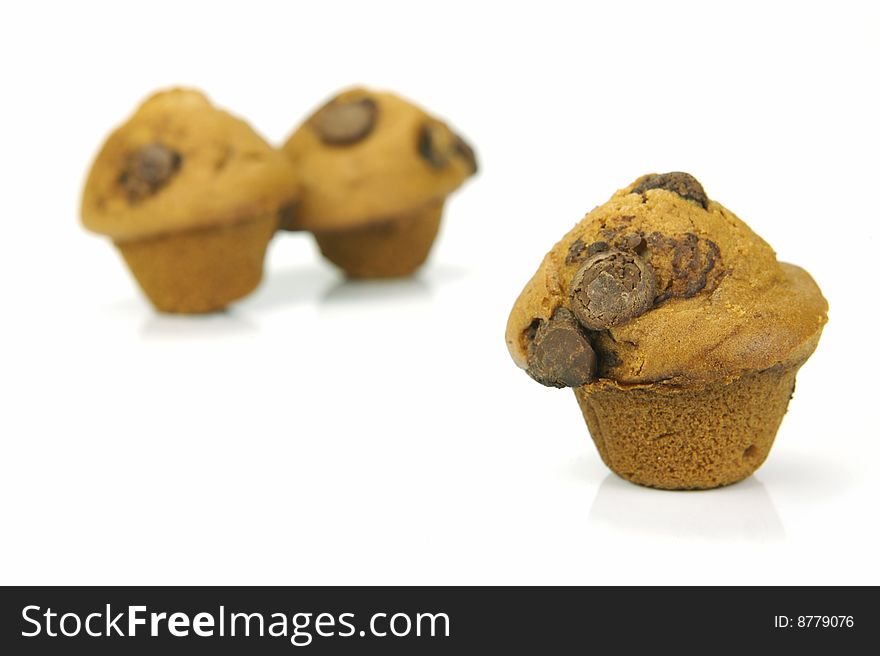 Choc chip mini muffins isolated against a white background. Choc chip mini muffins isolated against a white background