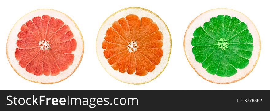 Three different color grapefruit slices isolated on white. Three different color grapefruit slices isolated on white