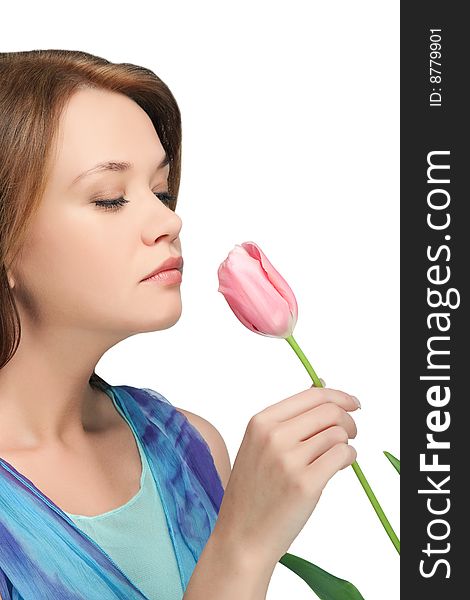 Girl  sniffing tulip over white