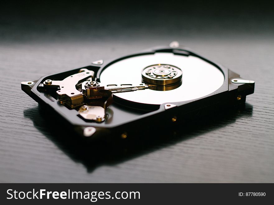 A hard disk drive opened up.