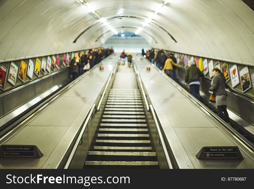 Stairs and escalators leading to a subway station. Stairs and escalators leading to a subway station.