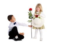 Little Boy With Rose And Girl Royalty Free Stock Photography