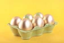 Golden Easter Eggs  In Carton Royalty Free Stock Photography