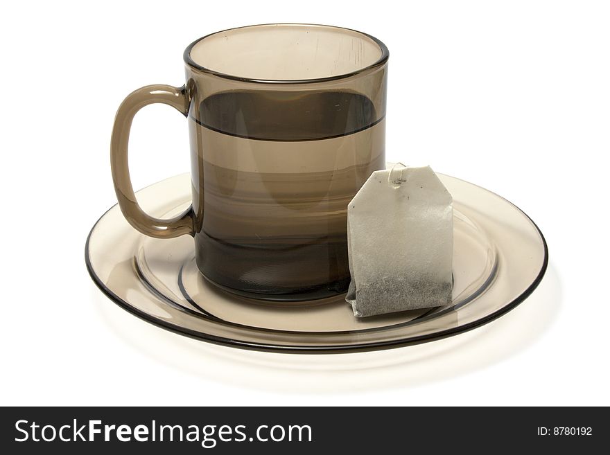 Tea cup and tea bag isolated on white