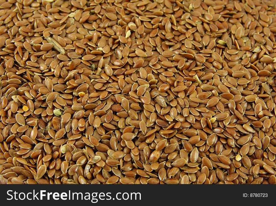 Brown linseed background, texture closeup