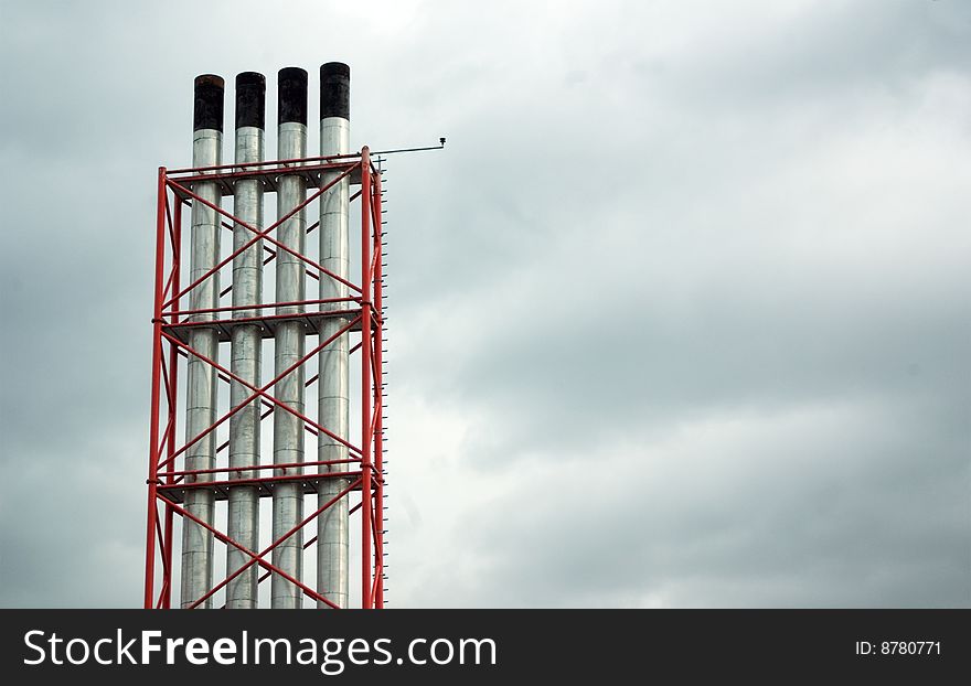 Four Chimneys set against the sky set off to the left. Four Chimneys set against the sky set off to the left.