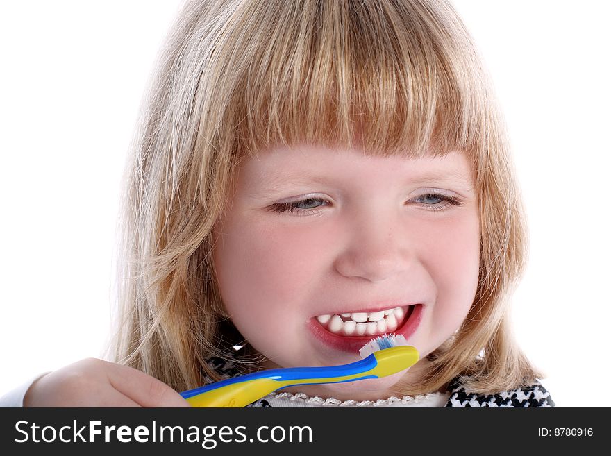 Little girl with brushes for teeth isolated on white