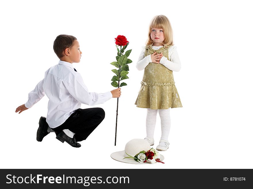 Little boy with rose and girl isolated on white